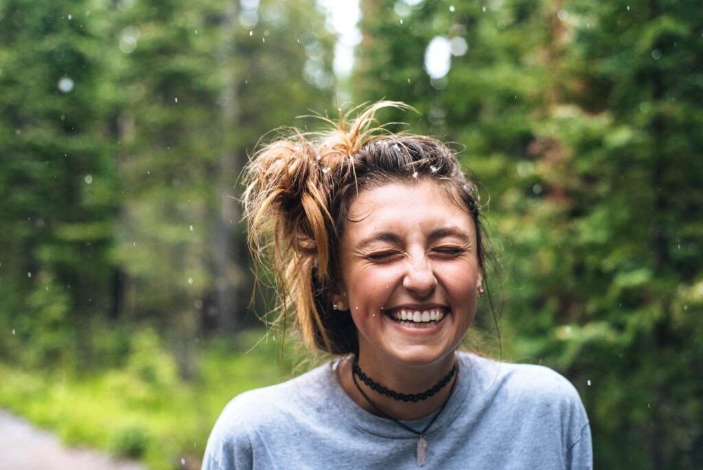 girl happy and smiling in the forest