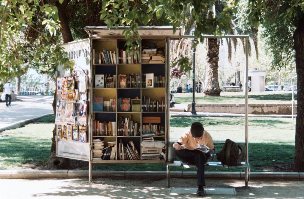 man reading in a park in santiago, chile