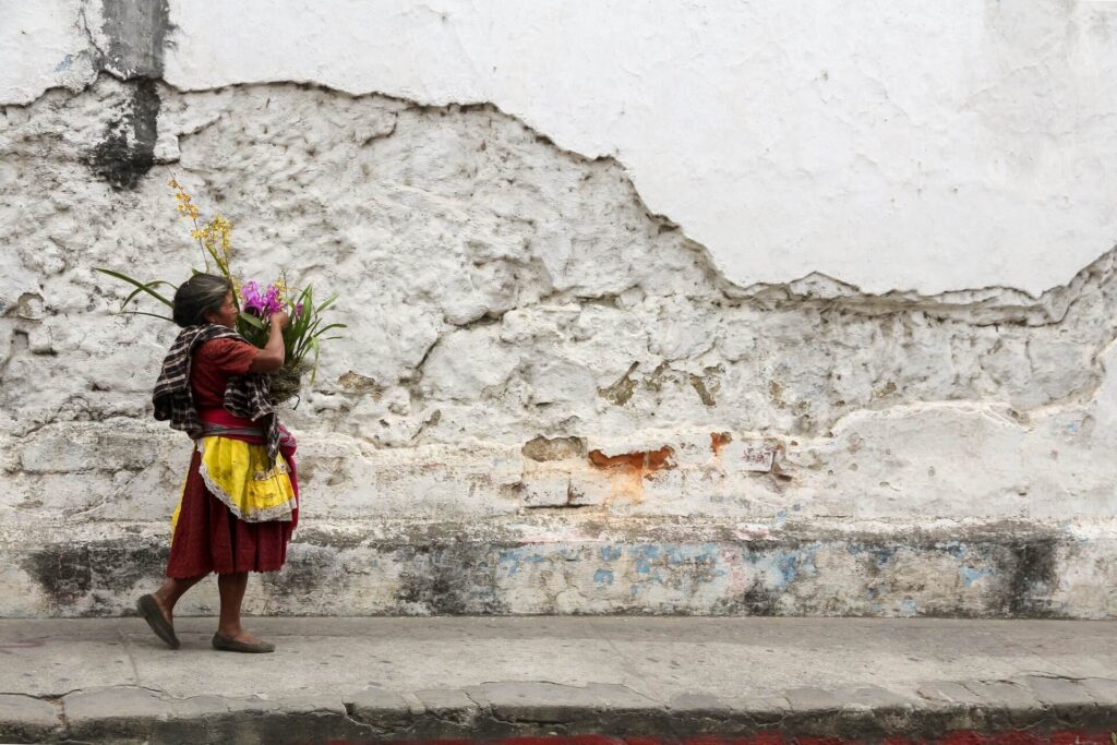 woman walking on the streets in antigua, guatemala