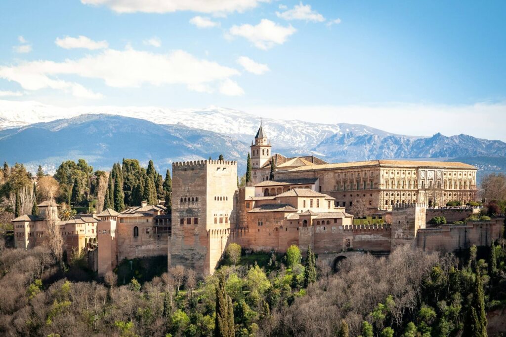 alhambra, spain, against a backdrop of mountains